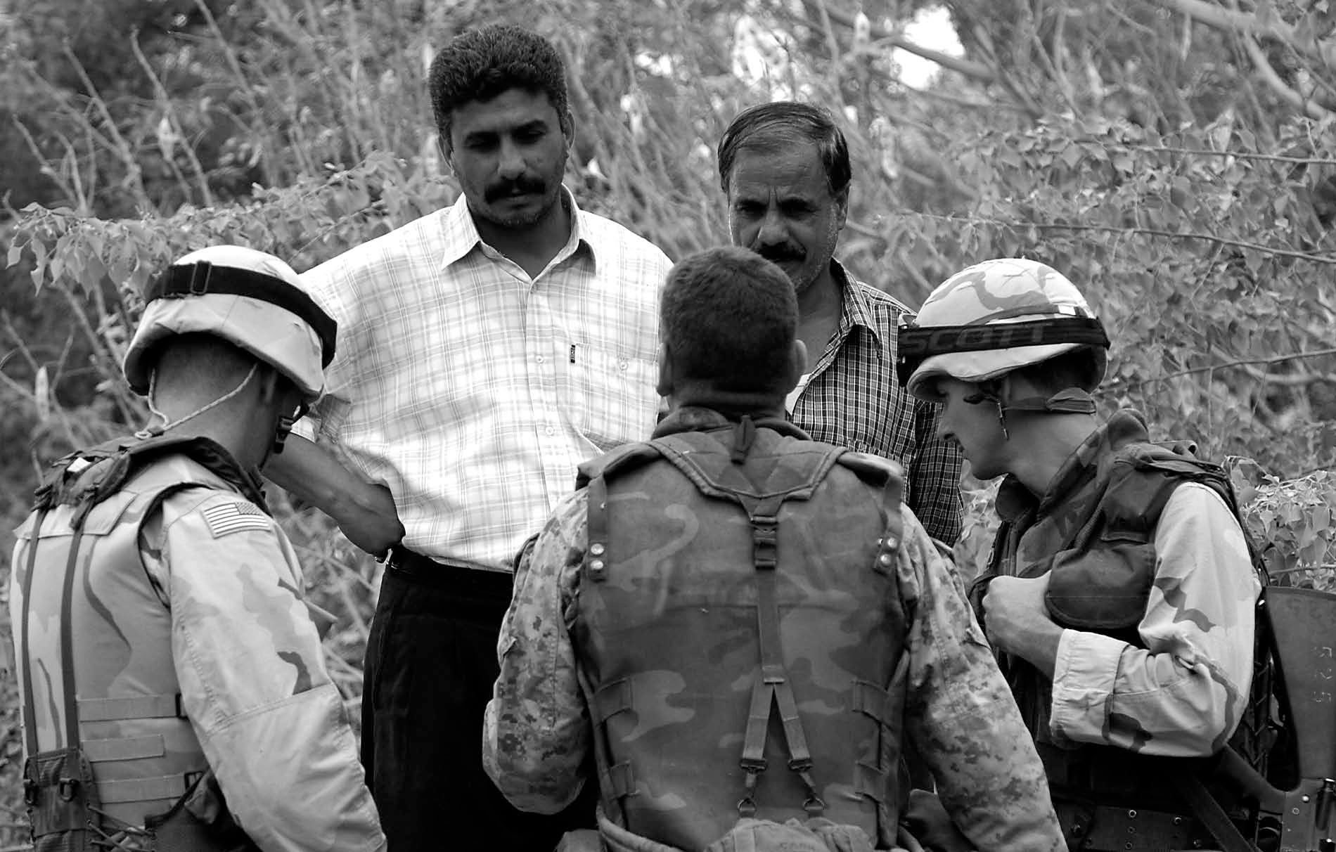 In COIN, the preponderance of HUMINT comes from the units who have the most familiarity and contact with the population. Those who have daily contact notice changing conditions in their areas before anybody else. In this photo, members of a civil affairs team work with Iraqi water treatment facility workers to assess the damage to a water treatment facility.